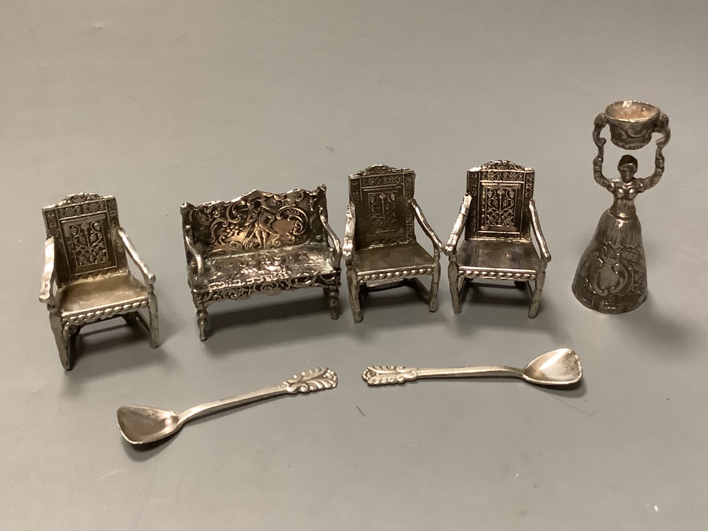 A set of three Edwardian silver miniature armchairs, Levi & Salaman, Birmingham, 1902, a similar settee, a continental miniature white metal wager cup & two sterling salt spoons.